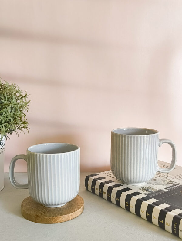 Handmade ceramic coffee mug in pastel grey