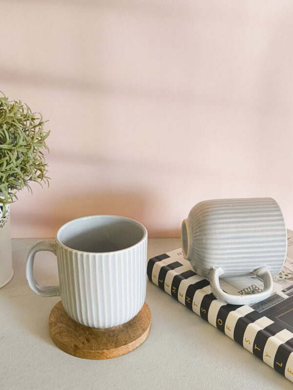 Handmade ceramic coffee mug in pastel grey