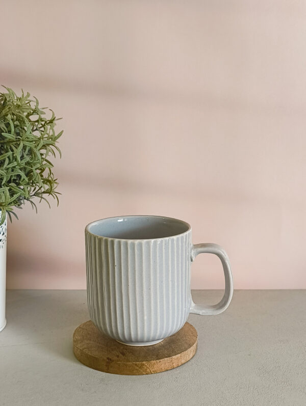 Handmade ceramic coffee mug in pastel grey