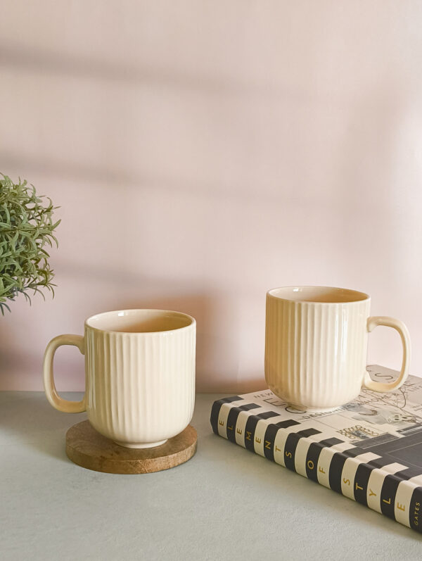 Handmade ceramic coffee mug in pastel beige