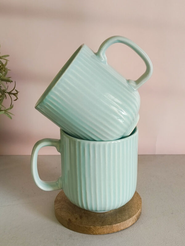 Handmade ceramic coffee mug in pastel green