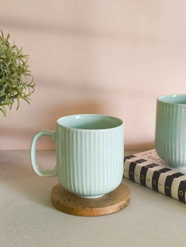 Handmade ceramic coffee mug in pastel green