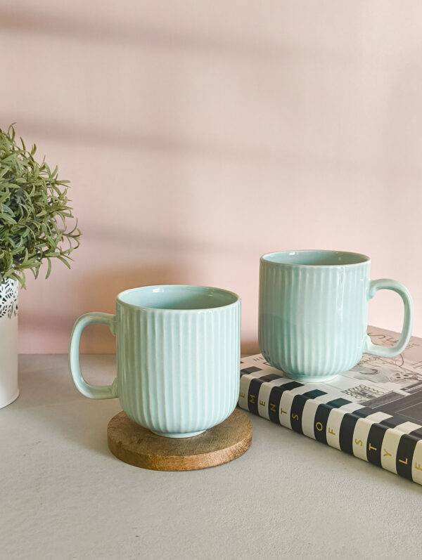 Handmade ceramic coffee mug in pastel green