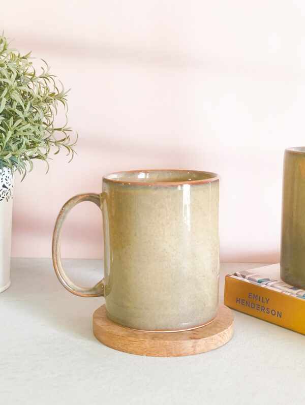 Discover the perfect blend of style and functionality with our handmade olive green broad ceramic coffee mug.